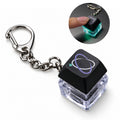 Custom clickable LED keycap keychain with green keycap, printed design and metal chain