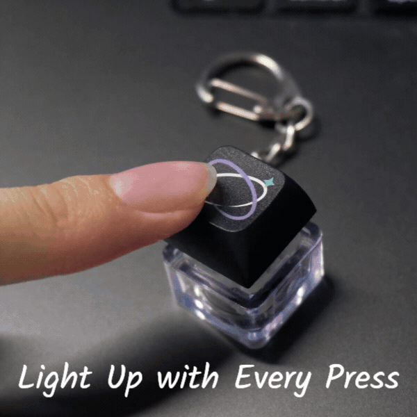 Animated demonstration of a clickable LED keycap keychain lighting up when pressed